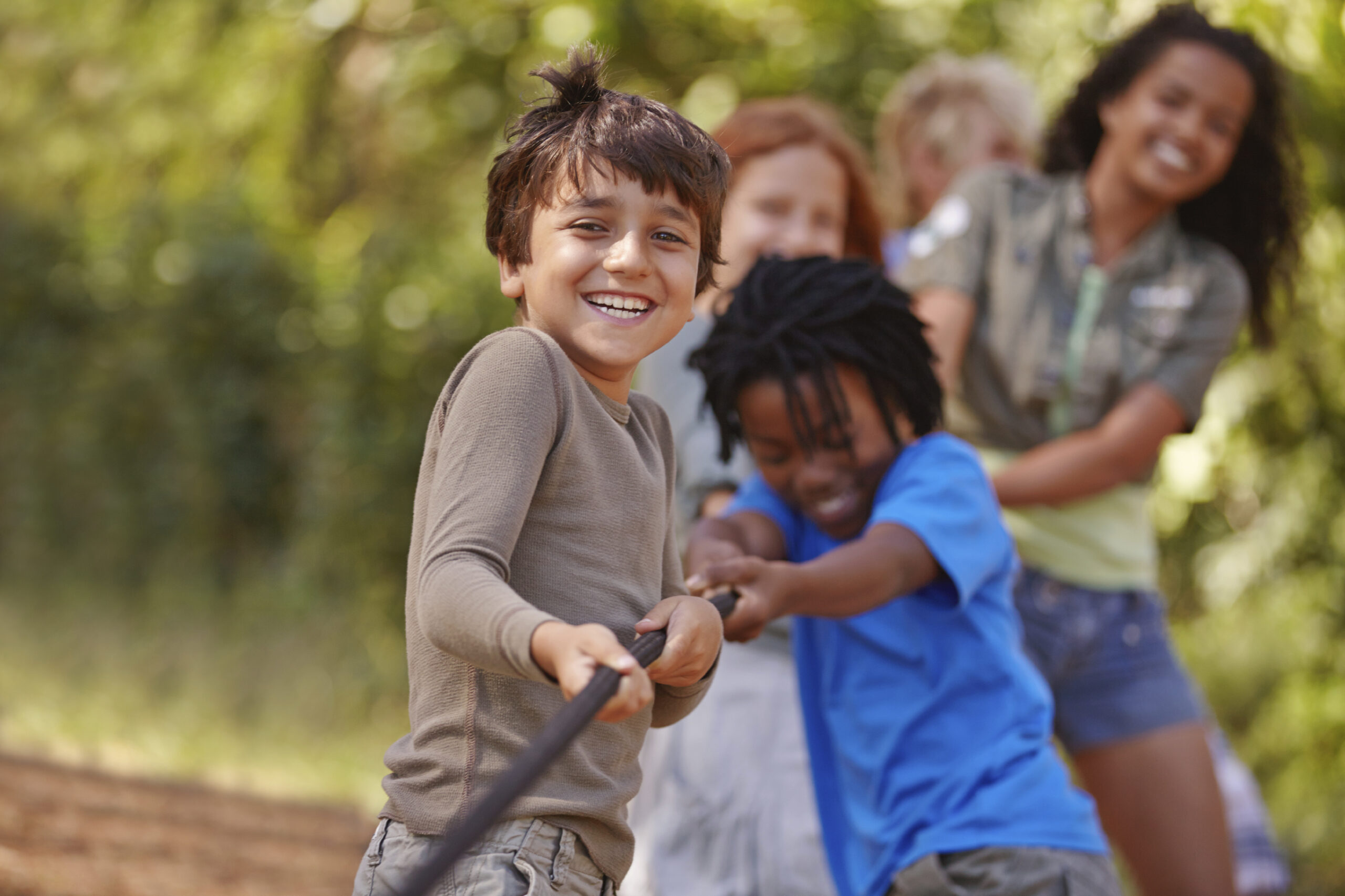 A group of kids in a tug-of-war game