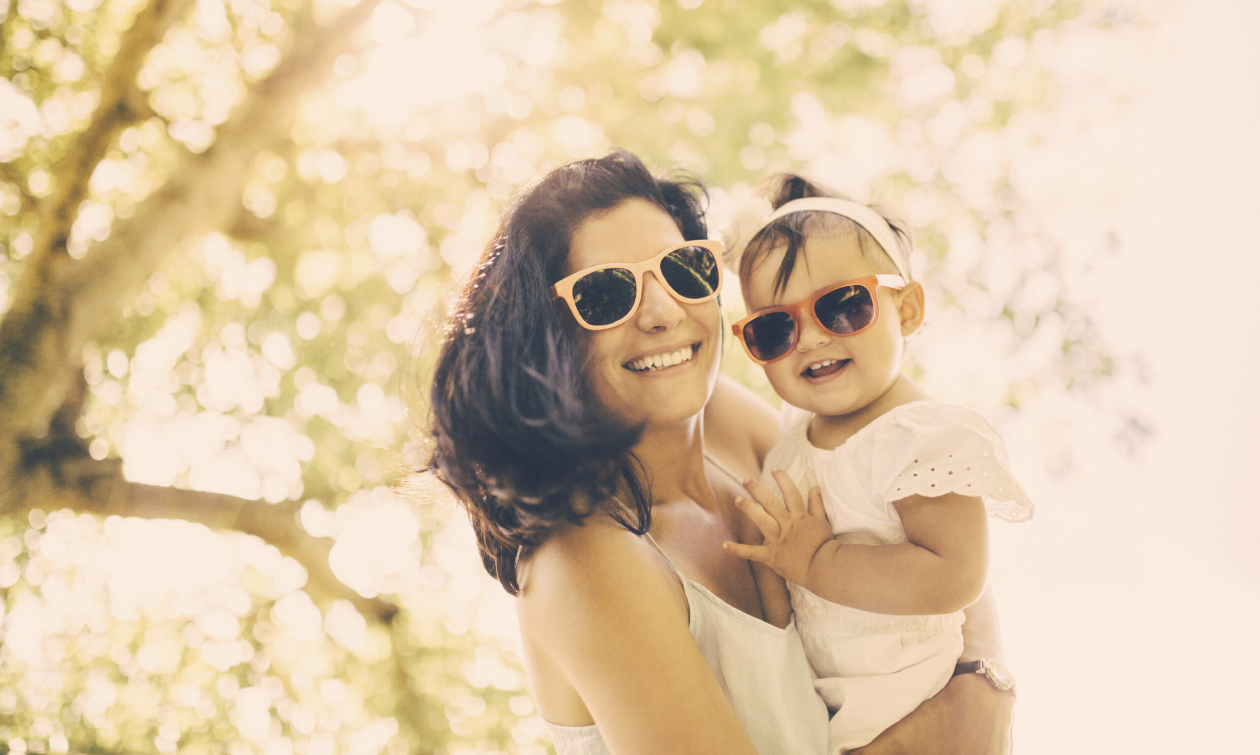Mother and baby with sunglasses