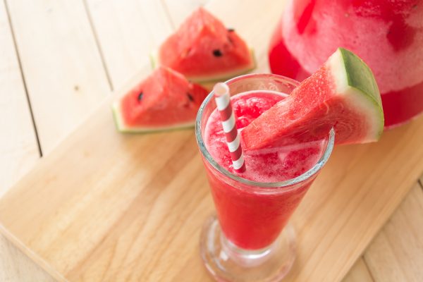 watermelon smoothie on wood background