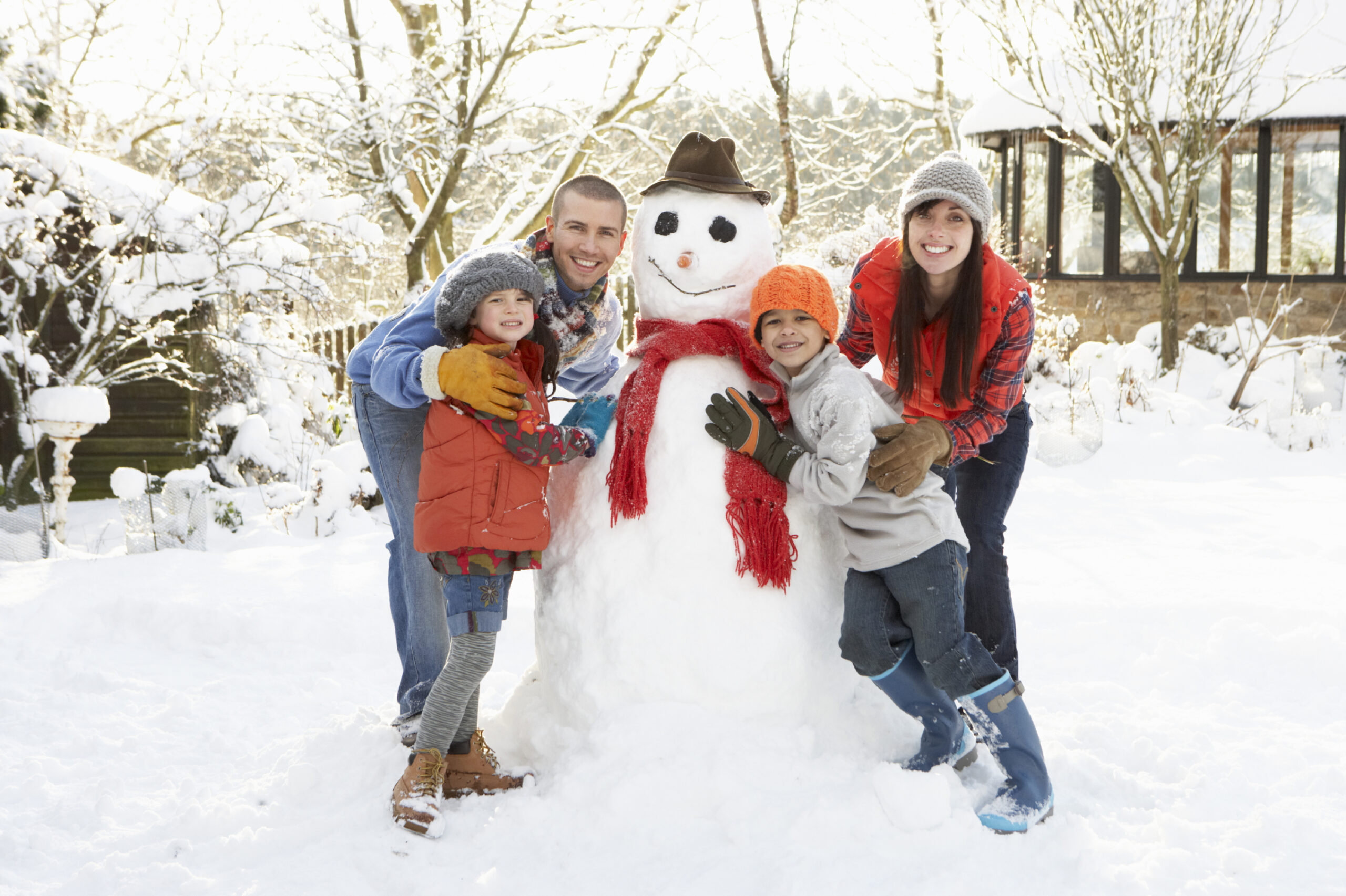 Family building snow man